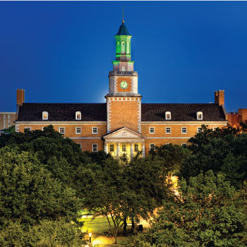 McConnell Tower illuminated green at the University of North Texas.